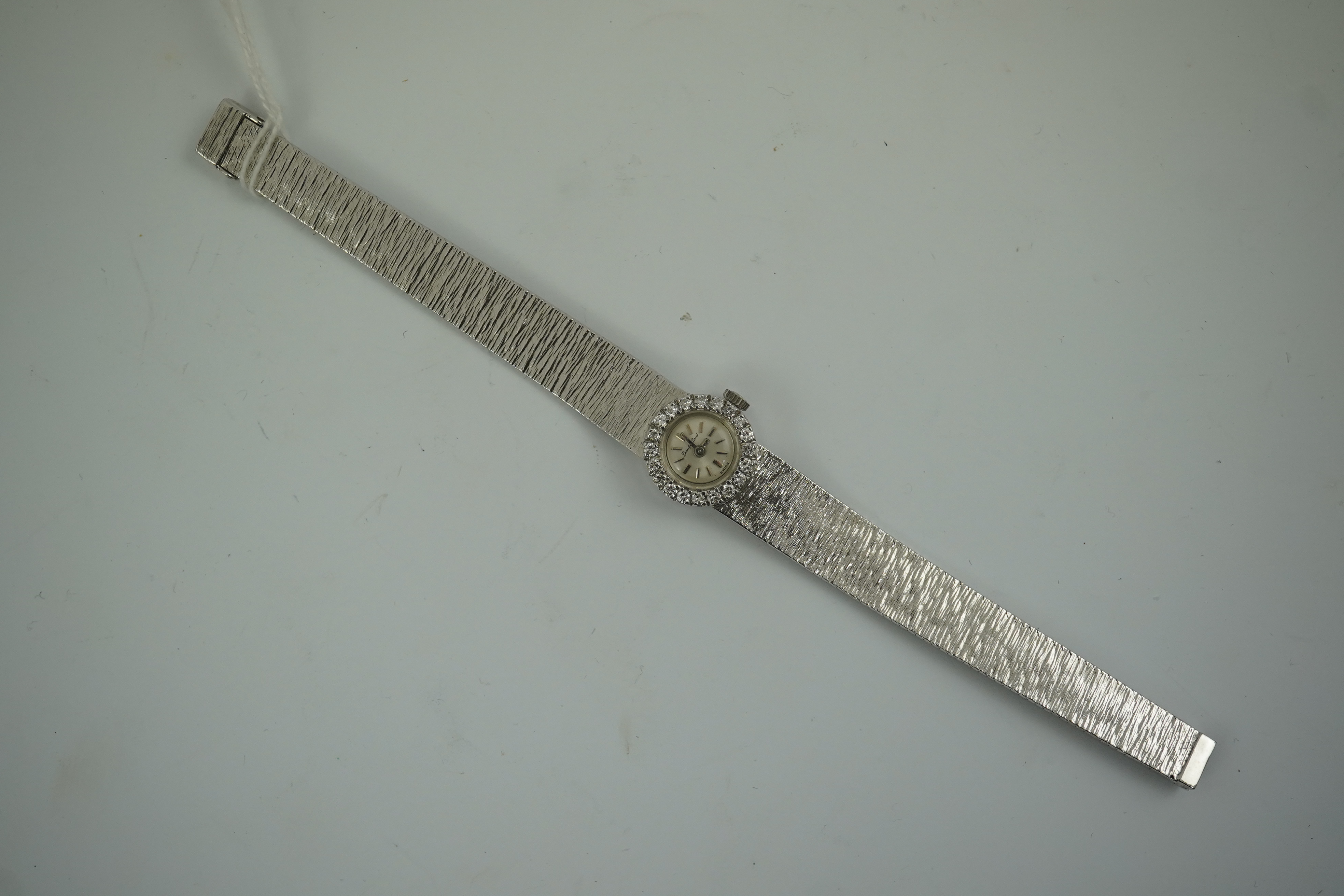 A lady's 9ct white gold and diamond set Bueche Girod manual wind wrist watch